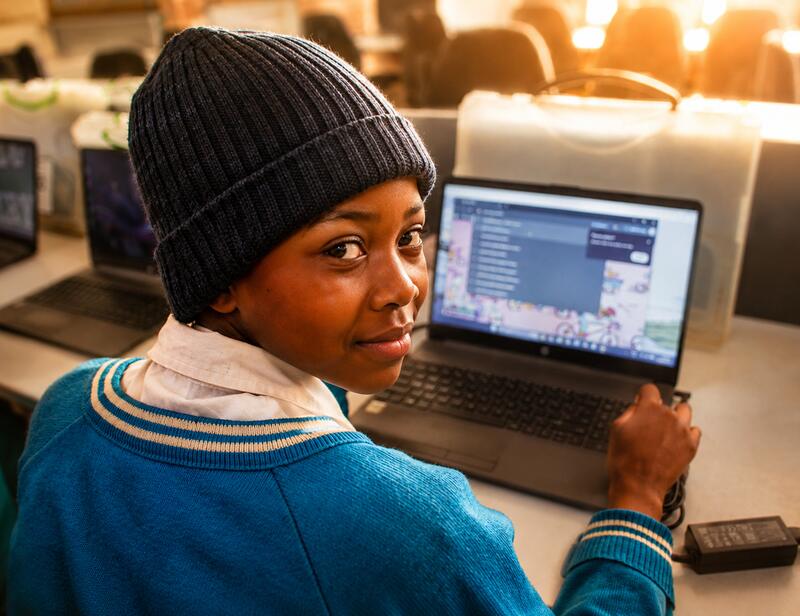A learner at a laptop
